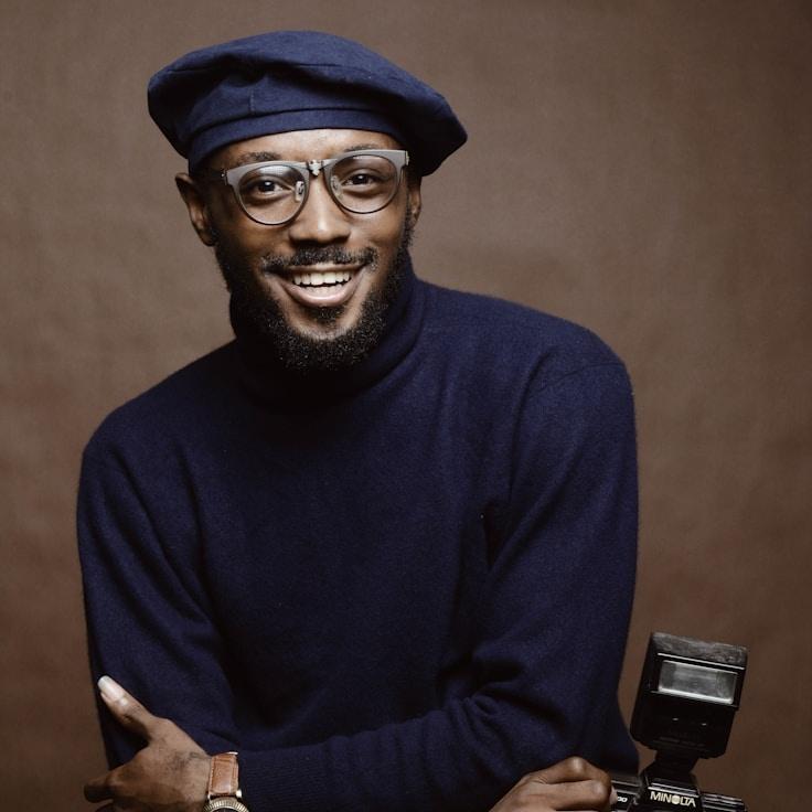 Kaveri Mehta, Lead Design Curator at Universal Data Connect, reviewing corporate floral arrangements